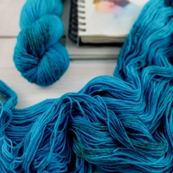 hand dyed speckled sock knitting yarn Woolento turquoise Jules